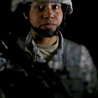 A Canadian paratrooper listens to a safety brief before