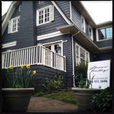 Traditional exterior by rw anderson homes blue grey house, yellow door, white trim and dark blue grey/charcoal shutters. Pin By Katie Poitevin On Paint House Exterior Blue Dutch Colonial Exterior Gray House Exterior
