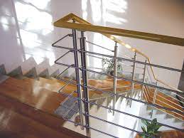 Our Stainless Posts And Round Bar Railing Pair With Wood Rails For A Warm Modern Aesthetic Call 800 772 Wood Handrail Steel Stairs Stainless Steel Staircase