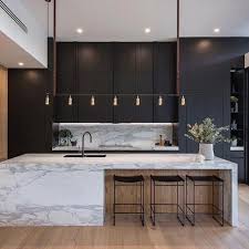 A Beautiful Combination Of Stone Dark Cabinetry And Oak In This Sophisticated Family Minimalist Kitchen Design Modern Kitchen Interiors Modern Kitchen Design