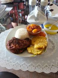 Puerto rican rice and beans with green olives. Puerto Rican Pork Chops In Sauce