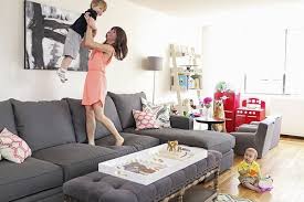 Smart kid friendly living room ideas. Gray Sofa White Walls Kids Nook Soft Ottoman Coffee Table Baby Play Areas Kid Friendly Living Room L In 2021 Kid Friendly Living Room Baby Play Areas Kids Living Rooms