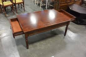 Top of this table comes in natural wood finish. Bombay Company 2 Drawer Coffee Table