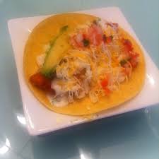 Fish tacos with shredded cheese. My Husband S Famous Fish Tacos Unbelievably Delicious Tilapia Avocado Blend Of Shred Cheese Secret Sauce Homemade Pico Wine Recipes Food Shredded Cheese