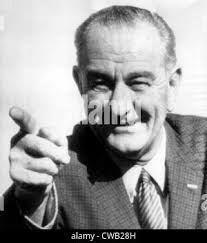 Photograph of Lyndon Johnson, President of the United States of America,  signing Civil Rights Act. Behind Johnson is Martin Luther King Jnr. Dated  1964 Stock Photo