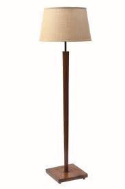 Features a deep blue ceramic base that is adorned with an oatmeal linen drum shade with natural slubbing. Mid Century Lamp Online