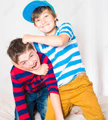 Cute boy in yellow shirt plays basketball on city playground. Two Young Boys In Bed And Fighting Stock Photo Picture And Royalty Free Image Image 29547606