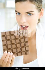 Close-up of three chocolate bars together, one is dark chocolate, one is  milk chocolate and one is white chocolate Stock Photo