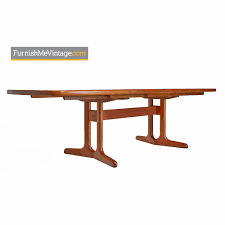Note the midcentury style, evoked by features such as tapered legs. Teak Trestle Base Dining Table Vintage Danish Modern Extension Leaf