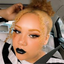 Is circus baby's hair red or orange? I always think it looks orange but I  see people doing cosplays of her with red hair. I wanted to dress as her  for Halloween