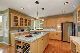 maple cabinets and large kitchen island