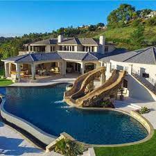 Backyard pools is now carrying recycled metal designs, such as metal peace signs, bird houses, and wooden flags. Dream Houses With Pools Novocom Top