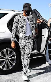The f1 racer typically maintains the same silhouette when selecting suits; Lewis Hamilton S Year Of Very Outlandish Outfits Daily Mail Online