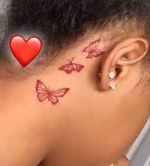 Hidden tattoos are a delight to discover. 3 Red Butterfly Tattoo Behind Ear