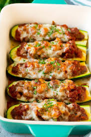 Sprinkle the stuffed zucchini boats with cheese and bake! Stuffed Zucchini Boats Dinner At The Zoo