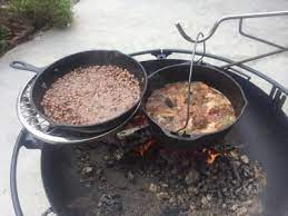 A portable grilling system designed for cooking over an open fire, the innovative kudu's elevated grate system invites you to grill, sauté, sear, fry, boil, smoke, and steam your food in the comfort of your backyard. Review Photo 1 Cowboy Fire Pit Fire Pit Grill Cowboy Grill