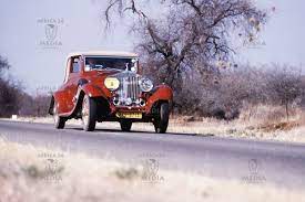 Vintage Classic Car On A Lonely Road Stretch In Zimbabwe Headed For A Car Show In Harare Classic Cars Vintage Landlocked Country Classic Cars