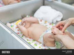 Baby massage for colic, gas + constipation. Baby Massage Mother Image Photo Free Trial Bigstock