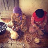 Moroccan Women Cracking Argan Nuts To Make Argan Olive Oil Morocco Travel Morocco What Is Like