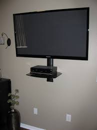 Floating wall mount underneath the television. Tv Wall Mount With Shelf For Cable Box Wall Mounted Shelves Flat Screen Wall Mount Wall Mounted Tv