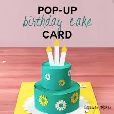 Press the tabs into the glue. How To Make A Pop Up Birthday Cake Card Jennifer Maker