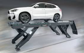 Does the vehicle provide option for rear and side loading hoist? Ravaglioli Rav Top Ranking Garage Equipment