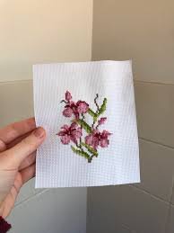 This simple yet elegant cross stitch pattern features beautiful white orchids on a printed aida background. Fo My First Finished Project Orchid Flowers Crossstitch