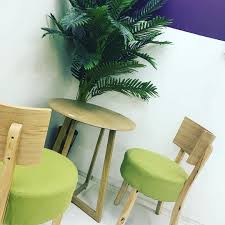 Wood Round Table With Two Small Green Chairs For Your Kitchen Corner Kitchen Design Styles Green Chair Kitchen Style