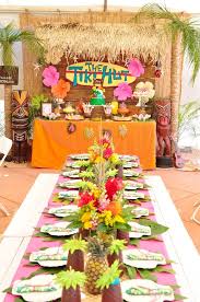 You'll find lots of pineapples and palm leaves in this tropical theme, which we adore. Tiki Hut Luau Party Kara S Party Ideas Luau Party Decorations Luau Theme Party Luau Birthday Party