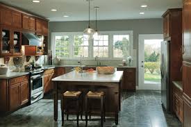 Transitional styling paired with a saddle finish gives these sinclair birch kitchen cabinets a casual, approachable feel. This Kitchen Was Designed For Holiday Baking Never Run Short Of Countertop Space For Mixing An Birch Kitchen Cabinets Kitchen Cabinet Design Kitchen Cabinetry