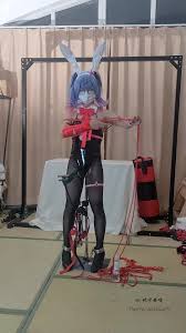 Sensual bound pleasure experience featuring a innocent doll in a naughty bunny suit and delicate ties