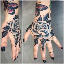 Black And Blue Roses Tattoo Black And Grey Rose Hand Tattoo By Andrea Revenant Hand Tattoos Blue Rose Tattoos Rose Tattoo Sleeve
