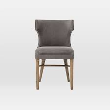 Somehow, this set of chairs is *that* versatile. Nailhead Upholstered Dining Chair