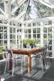 All Glass Sunroom With A Wood Dining Table And Clear Ghost Chairs Wow Decorating Blogs Conservatory Design Dining Room Design