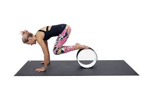 Yoga Wheel Tutorial Here Are 5 Ways To Use A Yoga Wheel Photos Yoga Wheel Yoga Wheel Guide Yoga Wheel Exercises