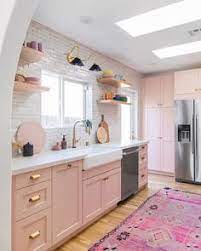 The slab doors in blush offer a striking way to inject personality into your kitchen. 36 Pink Kitchens Ideas Pink Kitchen Kitchen Design Pink Kitchen Cabinets