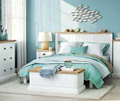 This coastal bedroom spotted on serena & lily has more than that prizewinning lakeside view going for it — it features a romantic blue vine print. School Of Fish Wall Art Decor Coastal Bedroom Decorating Beach Themed Bedroom Beach Style Bedroom