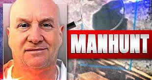 Caves and other mountain hideouts are being searched for fugitive known as  'Devil in the Ozarks'