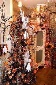 I'm so excited to show you these decorating ideas and i hope you love them as much as i this cute christmas turned halloween tree is all decorated for the season in candy corn colors. Halloween Tree Halloween Garland Fall Halloween Decor Halloween Trees