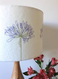 All flowers were carefully hand embroidered, which makes this shade unique. Lampshade Agapanthus Embroidered Felt Stitched Home Etsy Handmade Lampshades Freehand Machine Embroidery Agapanthus