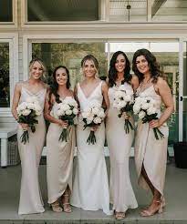 Bride With Her Bridesmaids In Neutral Colors With White Cream Bouquets Champagne Bridesmaid Dresses Wedding Dress Champagne Champagne Bridesmaid