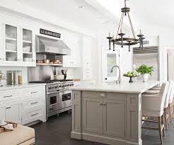 White Kitchen With Gray Or Greige Island Love The Stainless Steel Appliances Too Island Neutral Kitchen Designs Kitchen Design Decor Greige Kitchen