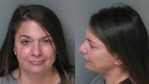 Police: Mom tried to stop officer from taking son to jail