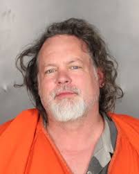 Violent man fights with police, damages apartment and cars