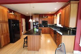 All our marble and gold dreams three studded barstools sit at the quartz waterfall island in this modern, bold kitchen. Black Quartz Countertop Houzz