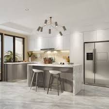 The bright kitchen showcases sleek cabinets, wooden dining set and a stone top island opposite the fireplace. Best Kitchen Suppliers Kitchen Cabinet Factory