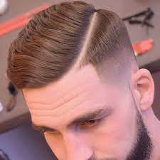 35 Best Men S Fade Haircuts The Different Types Of Fades 2021 Hard Part Haircut Mens Haircuts Fade Tapered Haircut