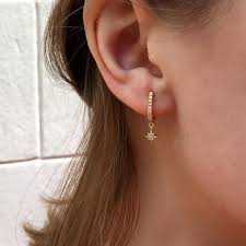Look polished and put together with these gleaming small round hoop earrings crafted of 14k gold. Star Cz Earrings Hoop Cz Earrings Small Hoops Cz Earrings Cz Hoops Hoop Earrings Dainty Earrings Dainty Hoops Minimalist Jewel Gold Earrings Designs Gold Earrings Indian Ear Jewelry