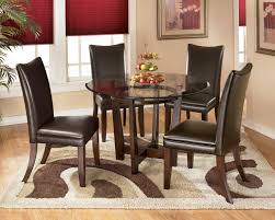 The laredo table features a walnut brown top and black legs. Modern Dining Table Set Designs