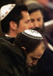 Doctors keep Sharon in induced coma